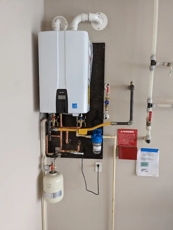 Professional plumber installing copper piping in a Leavenworth home